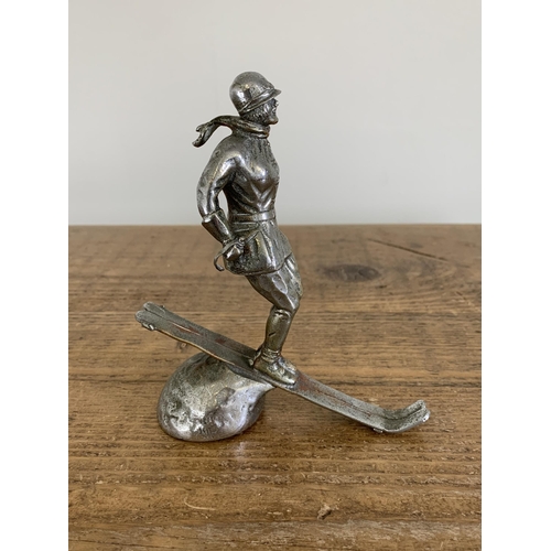 38 - An original scarce 1930's white metal car mascot 'Ski Lady' for the Riley Alpine car, marked to the ... 