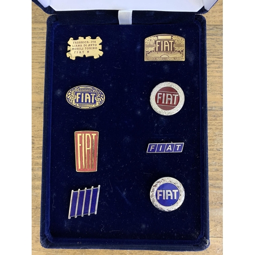 4 - A cased set of eight Fiat Centenary Year 1999 car badges