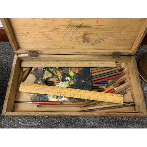 74 - A box of mixed metalwares including a very large copper ladle, two copper jugs, brass trivets and a ... 