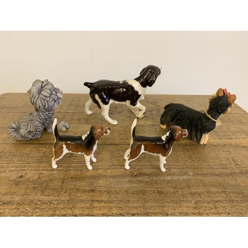 75 - A Royal Doulton spaniel, two 'Breed Apart' dogs plus two Beswick fox hounds (one as found to leg)