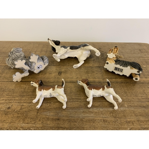 75 - A Royal Doulton spaniel, two 'Breed Apart' dogs plus two Beswick fox hounds (one as found to leg)