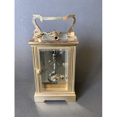 81 - A heavy brass Mappin & Webb key wind carriage clock with presentation plaque to front (winds, ticks ... 