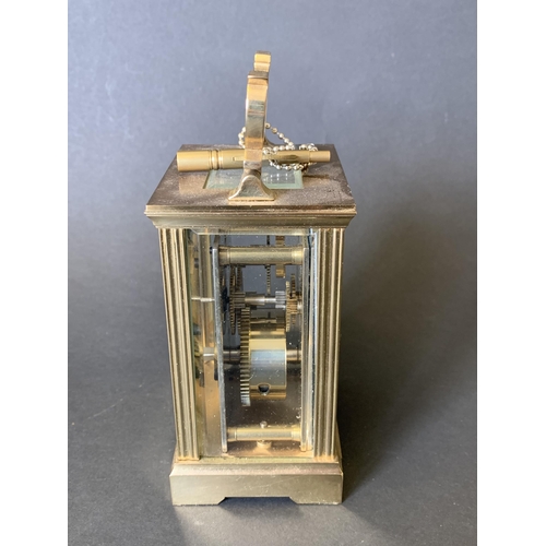 81 - A heavy brass Mappin & Webb key wind carriage clock with presentation plaque to front (winds, ticks ... 