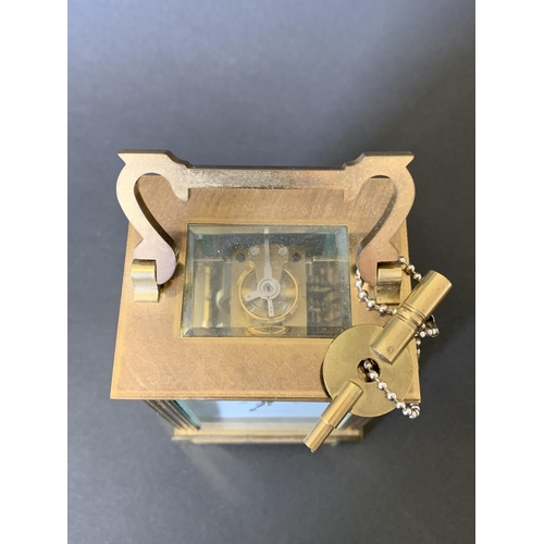 81 - A heavy brass Mappin & Webb key wind carriage clock with presentation plaque to front (winds, ticks ... 