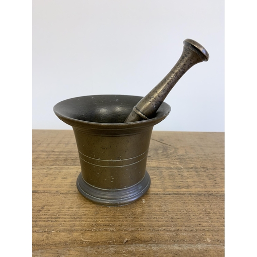 87 - An 18th Century large bronze pestle and mortar, 6