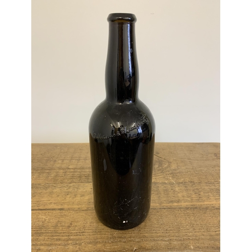 98 - A vintage Williams & Humbert Jerez sherry bottle with stamp dated 1877, brown glass, 13