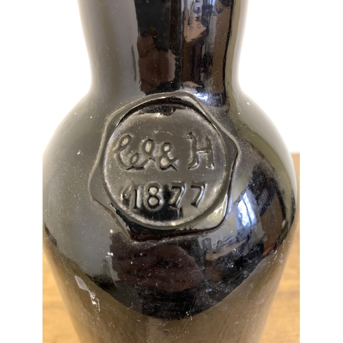 98 - A vintage Williams & Humbert Jerez sherry bottle with stamp dated 1877, brown glass, 13