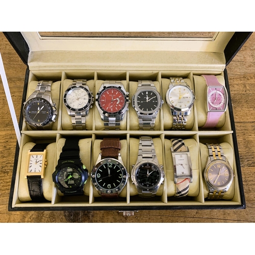 105 - A black watch case containing twelve watches (most are running at the time of lotting)