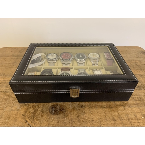 105 - A black watch case containing twelve watches (most are running at the time of lotting)