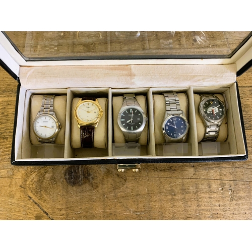 106 - Five quartz watches including Sekonda and Accurist in a costume case