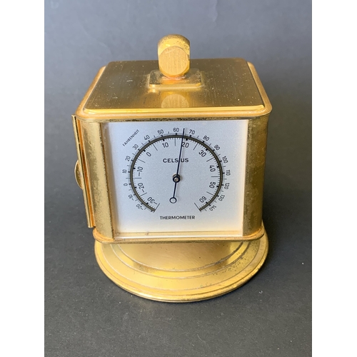 141 - A vintage 'looping' four face alarm clock and weather station, includes thermometer, barometer and h... 