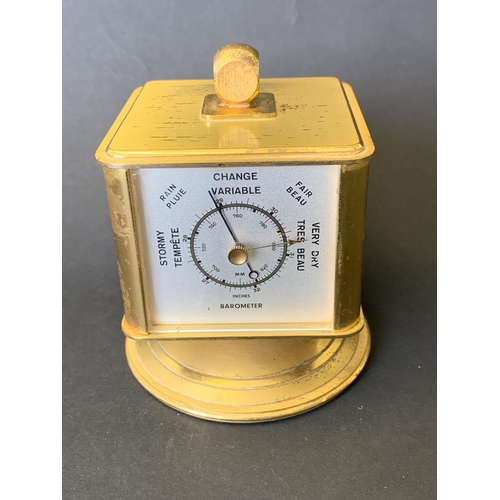 141 - A vintage 'looping' four face alarm clock and weather station, includes thermometer, barometer and h... 