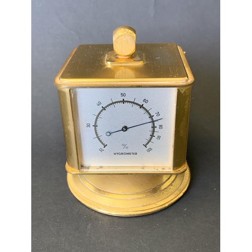 141 - A vintage 'looping' four face alarm clock and weather station, includes thermometer, barometer and h... 