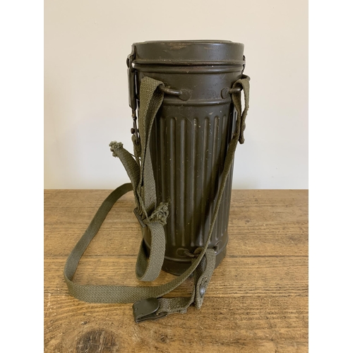 153 - A WW2 German late war long case gas mask with strap etc