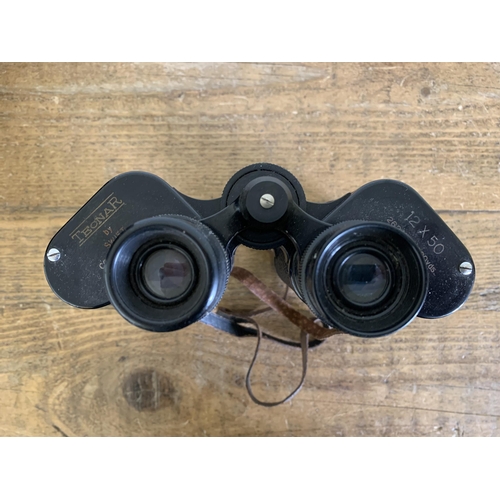 167 - A pair of cased Tecnar by Swift binoculars 12x50, good optics (case as found)