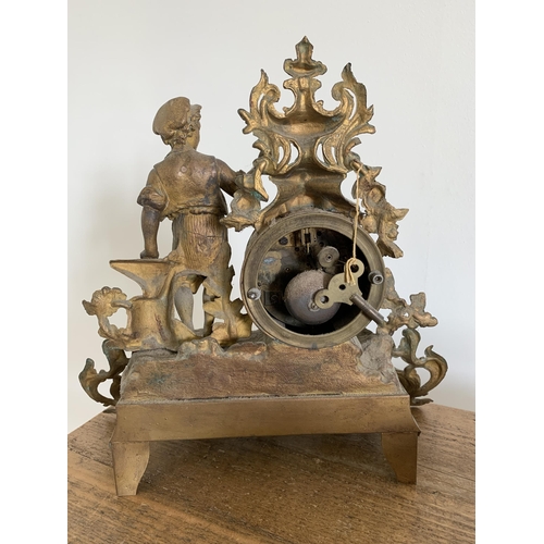 207 - Two gilded spelter mantel clocks, both approx. 11