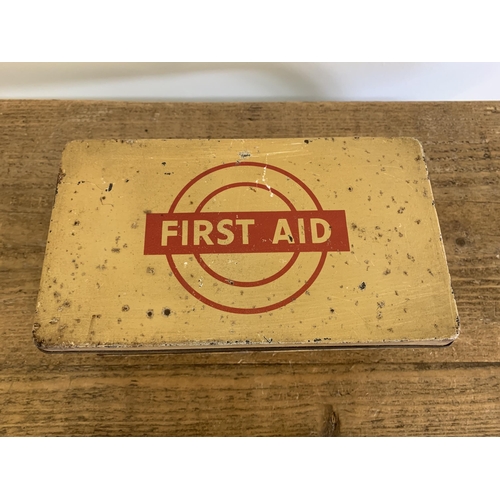 218 - A vintage first aid tin with contents of other tins, vintage packages etc plus an aluminium horse he... 