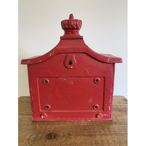 221 - A cast iron post box with key, later painted, approx. 14 1/2