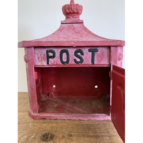 221 - A cast iron post box with key, later painted, approx. 14 1/2