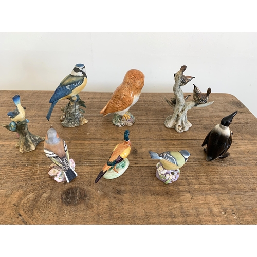 231 - A Beswick penguin, owl and pheasant, Royal Worcester blue tit and chaffinch (as found beak) plus thr... 