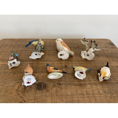 231 - A Beswick penguin, owl and pheasant, Royal Worcester blue tit and chaffinch (as found beak) plus thr... 