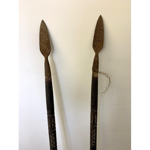 281 - Two antique wood handled spears with decorated shafts 48