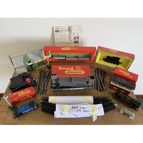 323 - Hornby train controller with transformer, OO gauge track and a made up garage, a boxed Hornby diesel... 