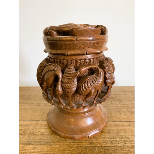 40 - A possibly Indian carved wood lidded bowl decorated with birds, approx. 9