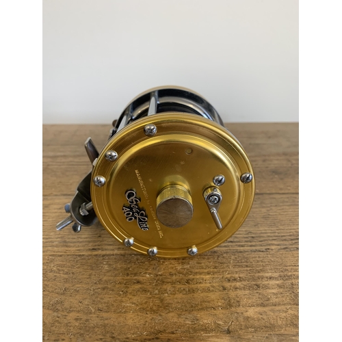 41 - A boxed Daiwa sea line 400 fishing reel and spare spool (used, but clean condition, box with wear)