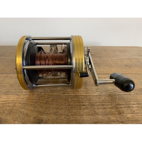 41 - A boxed Daiwa sea line 400 fishing reel and spare spool (used, but clean condition, box with wear)