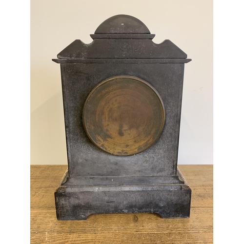 43 - An antique large slate mantel clock, key wind, inset with marble decoration, 15 1/4