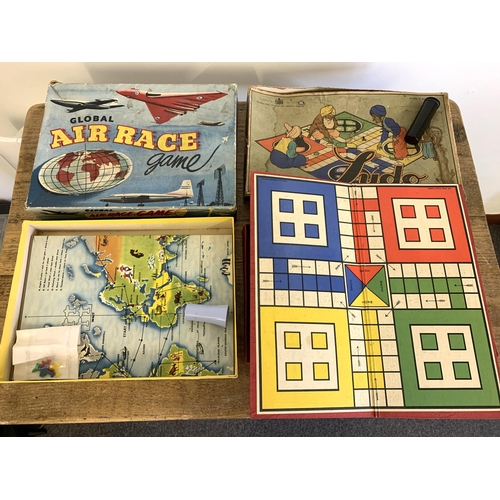 58 - Various vintage board and table games including an early Monopoly, two Blow Football, boxed 'Air Rac... 