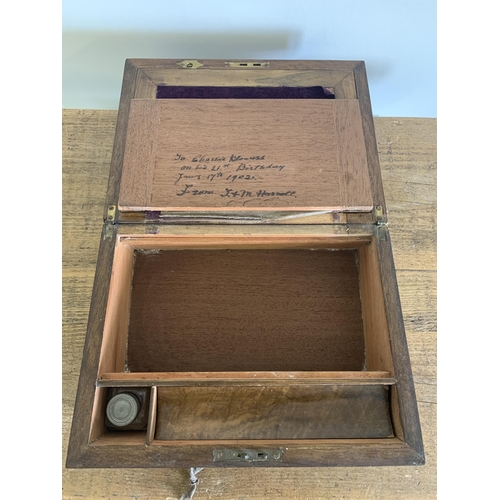 80 - A late 19th Century mahogany writing slope with velvet interior and glass ink bottle