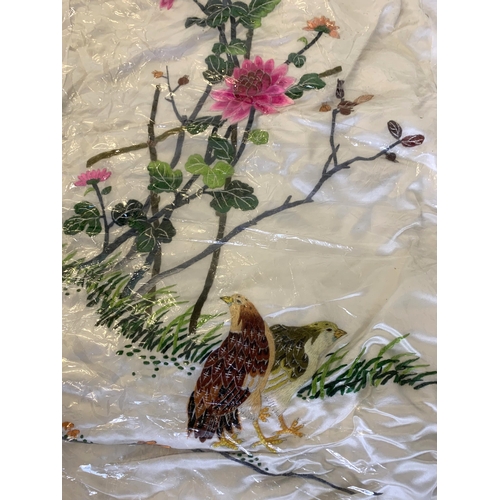 81 - A fine vintage Chinese hand sewn silk panel decorated with flowers and quail, the border lined with ... 