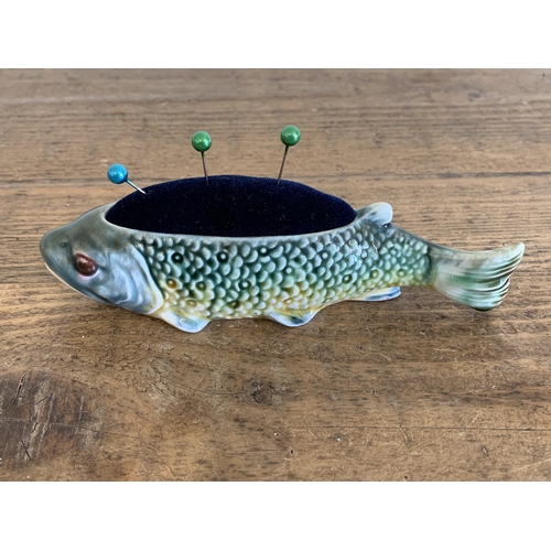 93 - A continental porcelain fish pin cushion, approx. 6