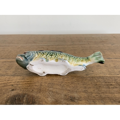 93 - A continental porcelain fish pin cushion, approx. 6