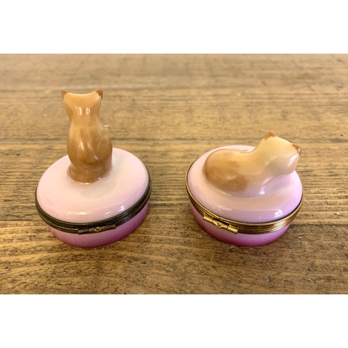 94 - A pair of Limoges Castel France hand painted pink pill pots surmounted with cats