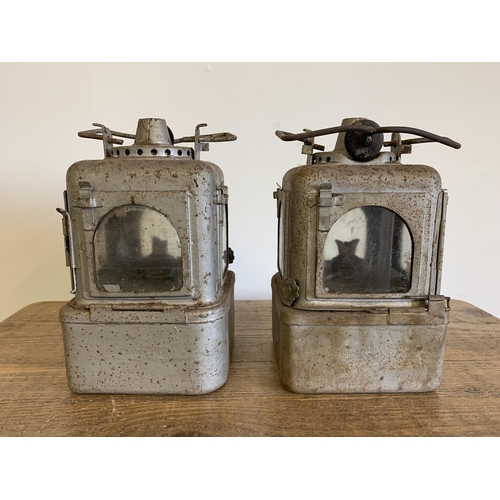 96 - A pair of vintage possibly railway lamps with later silver paint, approx. 11 1/2