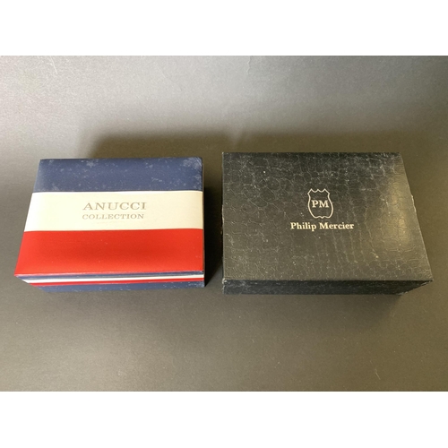 100 - A boxed Philip Mercier quartz gents watch and wallet set plus a boxed Anucci quartz watch, tie, cuff... 