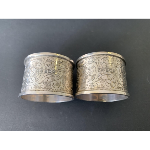 138 - A pair of cased hallmarked silver napkin rings in original box, Birmingham 1910, makers mark JR, bot... 