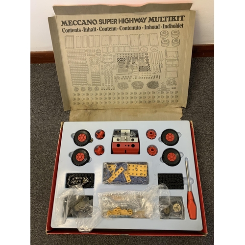 157 - A boxed vintage Meccano Super Highway Multikit (contents disturbed but appears complete, box with da... 