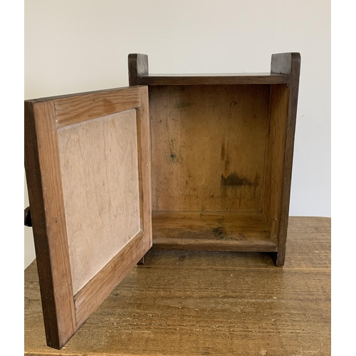 22 - A small wooden one door cabinet, 15 1/2