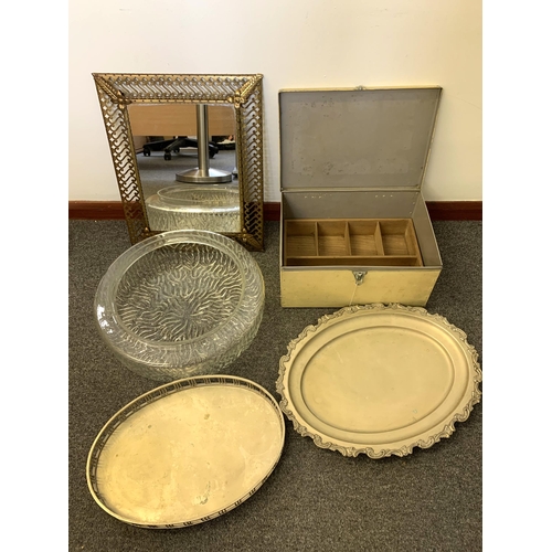 23 - A small brass framed mirror, two plated trays, a large glass light shade and a metal tin used as a t... 