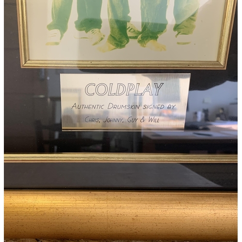 252 - A framed 'Remo Weatherking Ebony Ambassador' drumskin signed by Coldplay in gilt framed case, carrie... 