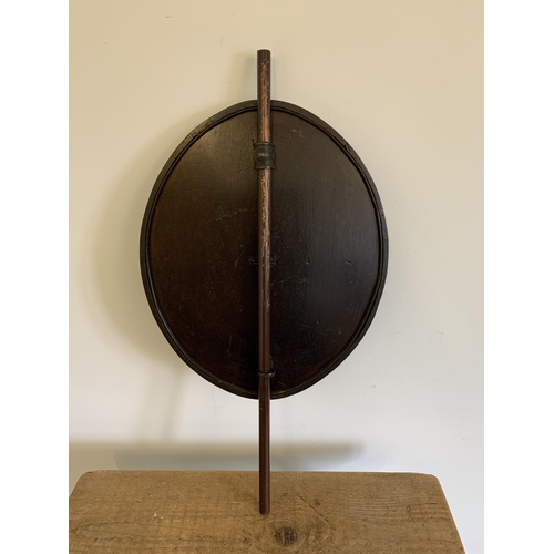 268 - A dark wood framed adjustable pole screen with tapestry panel (pole with split to one end)