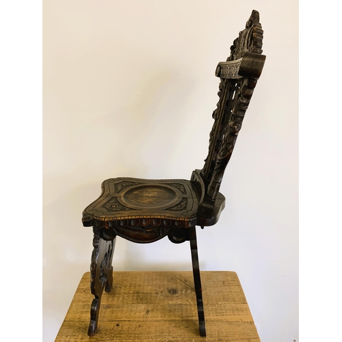 270 - A late 19th/early 20th Century Sgabello style carved wooden hall chair, carved griffon style creatur... 