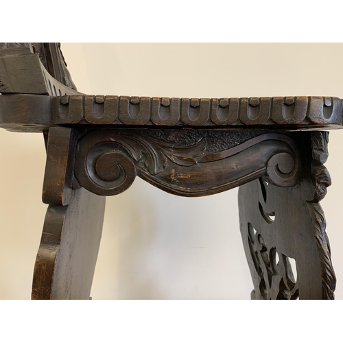 270 - A late 19th/early 20th Century Sgabello style carved wooden hall chair, carved griffon style creatur... 