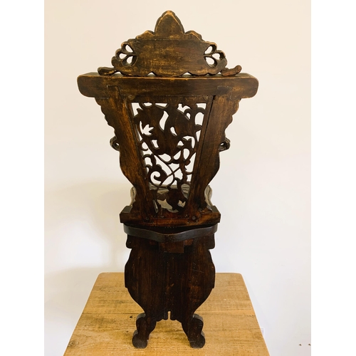 270 - A late 19th/early 20th Century Sgabello style carved wooden hall chair, carved griffon style creatur... 