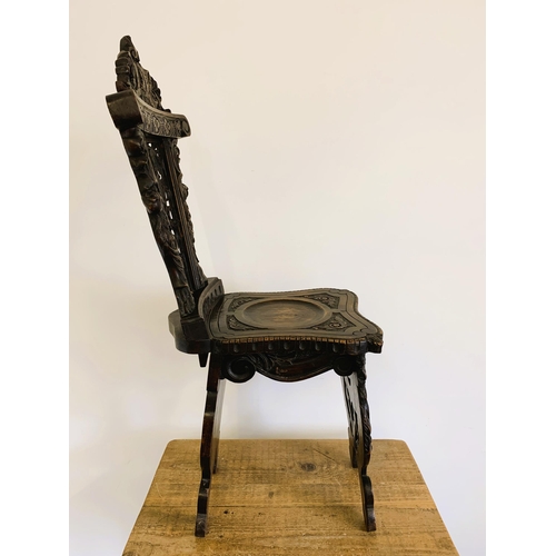 270 - A late 19th/early 20th Century Sgabello style carved wooden hall chair, carved griffon style creatur... 