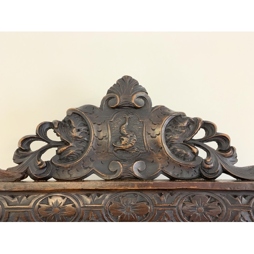 270 - A late 19th/early 20th Century Sgabello style carved wooden hall chair, carved griffon style creatur... 